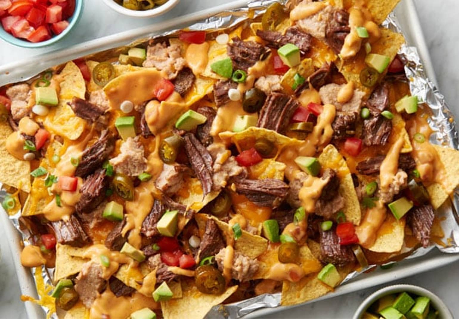 Slow-Cooker Beef Barbacoa Nachos with Queso